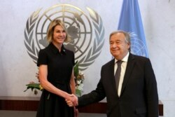 New U.S. Ambassador Kelly Knight Craft shakes hands U.N. Secretary General Antonio Guterres after she presented her credentials at United Nations headquarters, in New York, Sept. 12, 2019.