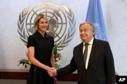 New U.S. Ambassador Kelly Knight Craft shakes hands U.N. Secretary General Antonio Guterres after she presented her credentials at United Nations headquarters, in New York, Sept. 12, 2019.