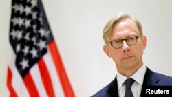 FILE - Brian Hook, U.S. special representative for Iran, attends a news conference in London, June 28, 2019.