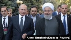 ARMENIA -- Russian President Vladimir Putin and Iranian President Hassan Rouhani arrive for a meeting on the sidelines of a session of the Supreme Eurasian Economic Council In Yerevan, Armenia. October 1, 2019.