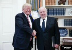 FILE - President Donald Trump shakes hands with Russia’s ambassador to the U.S., Sergei Kislyak, in this photo tweeted by the Russian Embassy.