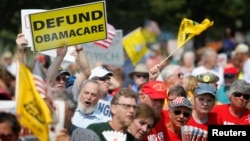 Opponents of President Barack Obama's Affordable Health Care Act rally on the west lawn of the U.S. Capitol in Washington, Sept. 10, 2013.