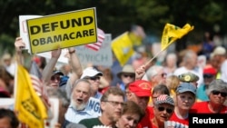 FILE - Opponents of President Barack Obama's Affordable Health Care Act rally near the U.S. Capitol in Washington, Sept. 10, 2013. Republicans in Congress have tried more than 60 times in the past six years to defund the program that now insures 22 million Americans.
