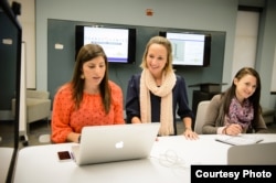 Students at Clemson University in Clemson, South Carolina work at their jobs at the Pearce Center for Professional Communication.