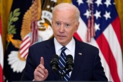 FILE - President Joe Biden speaks during a news conference in the East Room of the White House, March 25, 2021, in Washington.