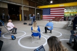 With his supporters using social distancing, Democratic presidential candidate Joe Biden outlines his economic plan while speaking at McGregor Industries in Dunmore, Pa., July 9, 2020.