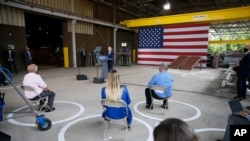 With his supporters using social distancing, Democratic presidential candidate former Vice President Joe Biden outlines his economic plan while speaking at McGregor Industries in Dunmore, Pa., July 9, 2020.