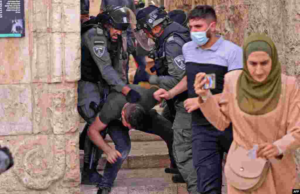 Israeli security forces detain a Palestinian protester amid clashes in Jerusalem&#39;s Old City ahead of a planned march to commemorate Israel&#39;s takeover of Jerusalem in the 1967 Six-Day War.