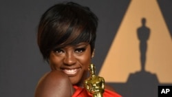 Viola Davis poses in the press room at the Oscars on Sunday, Feb. 26, 2017, at the Dolby Theatre in Los Angeles. 