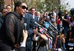 Marvin Gaye's daughter, Nona Gaye, left, talks to the media outside the Los Angeles U.S. District Court after a jury awarded the singer's children nearly $7.4 million in copyright claim, March 10, 2015.