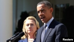 FILE - President Barack Obama delivers a statement alongside then-secretary of state Hillary Clinton, at the Rose Garden of the White House in Washington, Sept. 12, 2012.