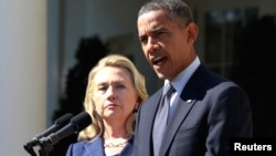 President Barack Obama delivers a statement alongside Secretary of State Hillary Clinton, following the death of the U.S. Ambassador to Libya, Chris Stevens, and others, from the Rose Garden of the White House in Washington, September 12, 2012