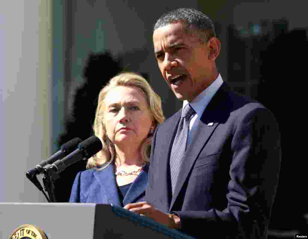 President Barack Obama delivers a statement with Secretary of State Hillary Clinton from the Rose Garden of the White House in Washington, September 12, 2012