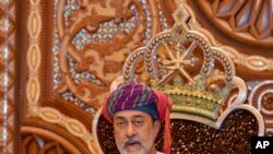 In this photo made available by Oman News Agency, Oman's new sultan Haitham bin Tariq Al Said, makes his first speech after swearing in at the Royal Family Council in Muscat, Oman,vJan. 11, 2020.
