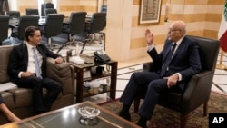 U.S. envoy Amos Hochstein speaks with Lebanese caretaker Prime Minister Najib Mikati during a meeting in Beirut, Oct. 21, 2024. 