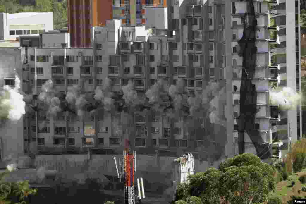 The CuatroTorres residential building complex is demolished during a controlled implosion, in the city of Medellin, Colombia.