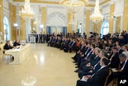 Russian President Vladimir Putin, second left, and Turkish President Recep Tayyip Erdogan, left, hold a news conference in the Konstantin palace outside St. Petersburg, Russia, Aug. 9, 2016.