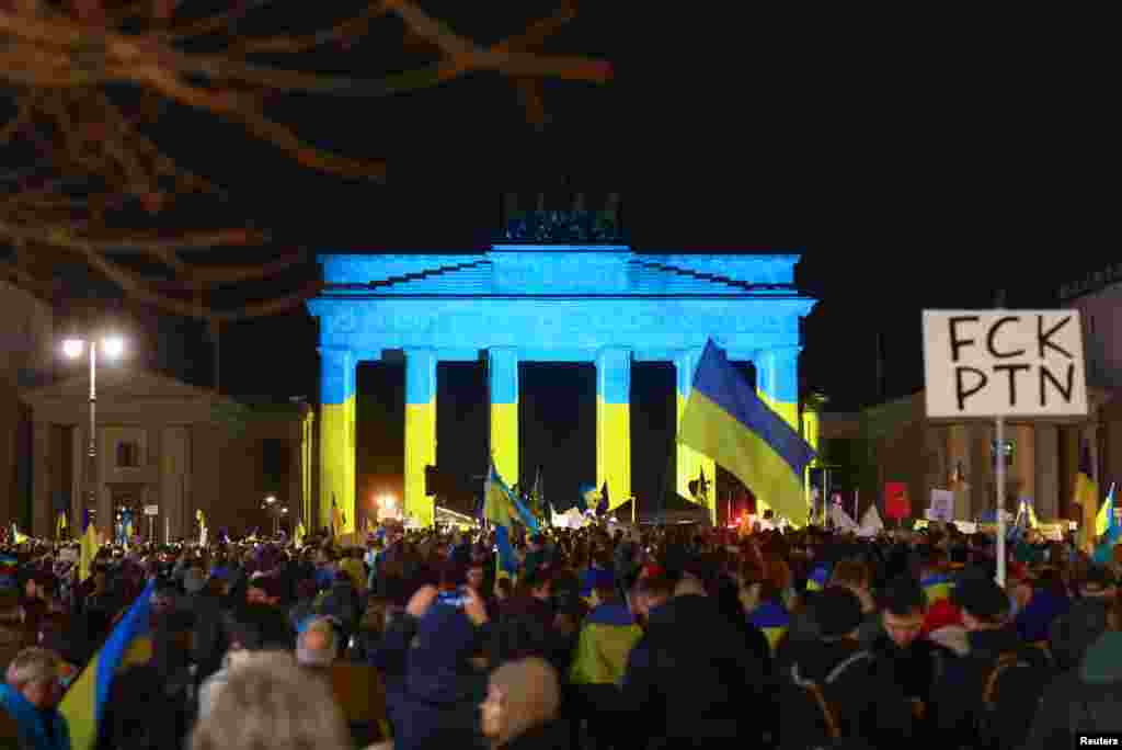 Ukraine supporters gather to mark the third anniversary of Russia&#39;s invasion of Ukraine, near Berlin&#39;s Brandenburg Gate, in Berlin, Germany.