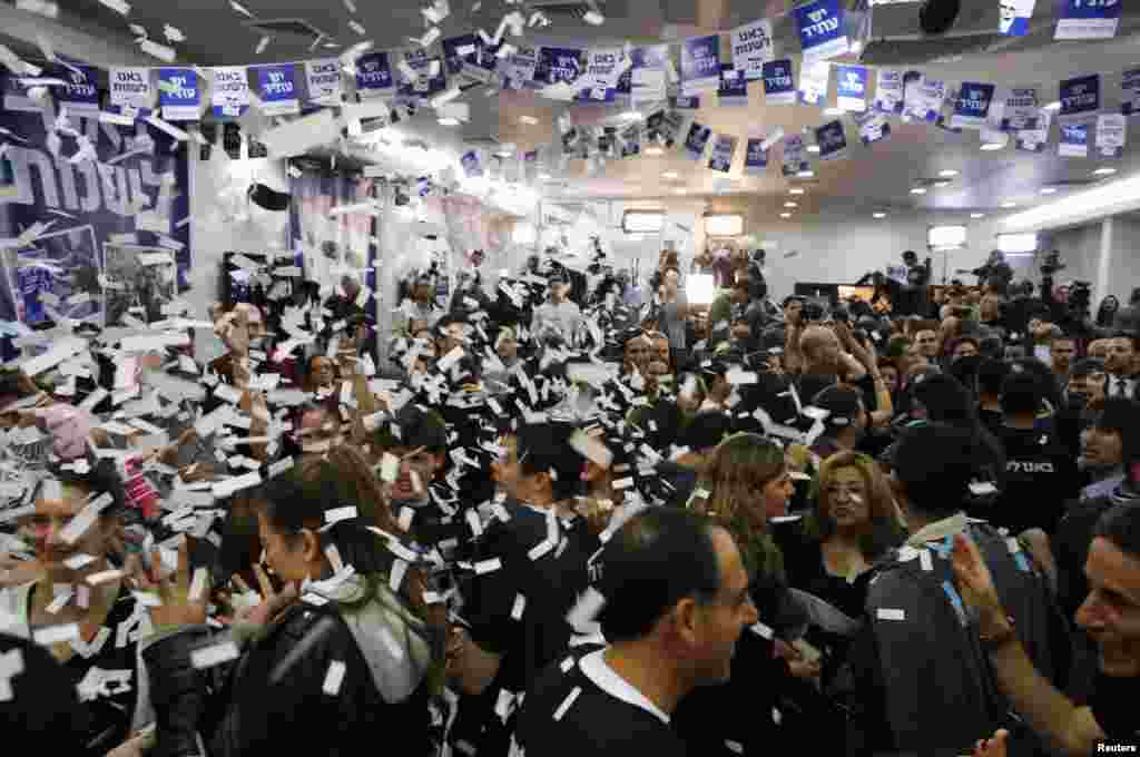 Supporters of Yair Lapid's Yesh Atid (There is a Future) party celebrate at the party's headquarters in Tel Aviv, Israel, January 23, 2013. 