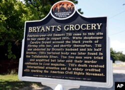 FILE - A Mississippi Freedom Trail marker recaps the significance of Bryant's Grocery and Meat Market, left, now in ruins, in Money, Miss., where in 1955, 14-year-old Emmett Till allegedly whistled, grabbed and made sexual advances to a white woman.