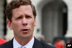 FILE - Rep. Robert Dold, R-Ill., a co-sponsor of the House gun control bill, says, "It's time for action."