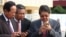 FILE PHOTO - Senior Cambodian government officers are using their smartphones while awaiting the return of Cambodian Prime Minister Hun Sen from France at Phnom Penh International Airport.