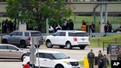 Emergency personnel respond outside the Pentagon Metro area, Aug. 3, 2021, at the Pentagon in Washington. A Pentagon police officer was stabbed to death at the transit station and his attacker then shot himself, authorities said.