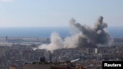 Ongoing hostilities between Hezbollah and Israeli forces in Beirut suburbs, as seen from Baabda