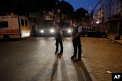 Police officers man on Fonthill road near Finsbury Park station after a vehicle struck pedestrians in north London, June 19, 2017.