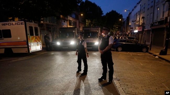 Police officers man on Fonthill road near Finsbury Park station after a vehicle struck pedestrians in north London, June 19, 2017.