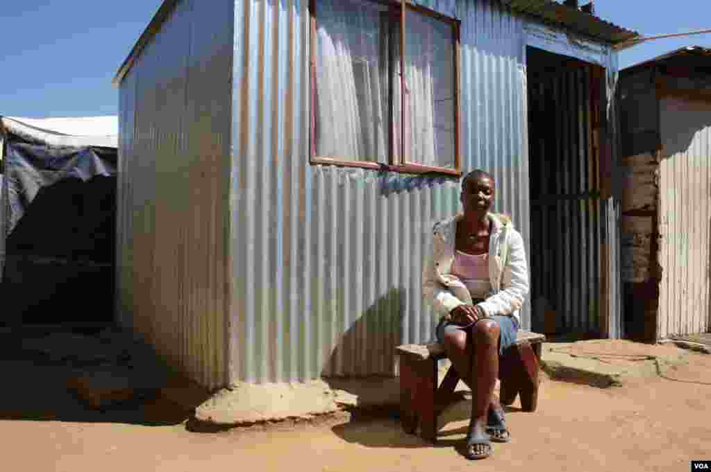 Maureen Mabuza experienced a &quot;mirculous recovery&quot; with anti-retroviral treatment. She sits in front of her one-room shack. (Photo by Darren Taylor)