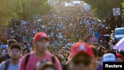 Migrants walk in a caravan during U.S. Presidential election day, in an attempt to reach Mexico's northern border, in Tapachula, Mexico Nov. 5, 2024.