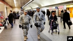 Members of the New York National Guard patrol Penn Station, March 22, 2016, in New York. 