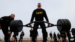 U.S Army 1st Lt. Mitchel Hess participates in a weight lifting drill while preparing to be an instructor in the new Army combat fitness test at Fort Bragg, N.C., Jan. 8, 2019. The new test is designed to be a more accurate test of combat readiness than th