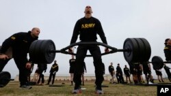 U.S Army 1st Lt. Mitchel Hess participates in a weight lifting drill while preparing to be an instructor in the new Army combat fitness test at Fort Bragg, N.C., Jan. 8, 2019. The new test is designed to be a more accurate test of combat readiness.