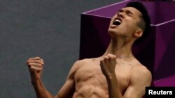 Reaksi Jonatan Christie saat menang laga semifinal tunggal putra Asian Games, di Jakarta, 27 Agustus 2018. 