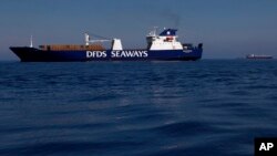 A Danish cargo ship Ark Futura carries containers with Syria's dangerous chemical weapons out of the strife-torn country, out of Cyprus coastal city Larnaca, on Tuesday, May 13, 2014