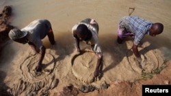 FILE - Artisanal miners pan for diamonds, which fuelled the 1991-2002 civil war, in the town of Koidu in eastern Sierra Leone, Apr. 21, 2012. 