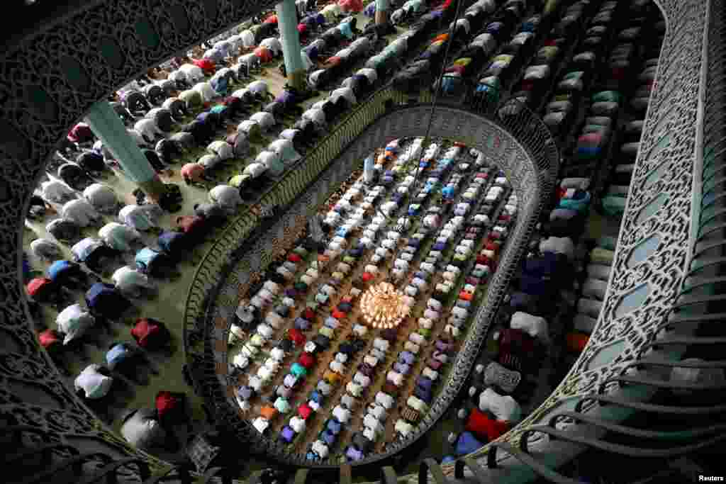 Muslims perform Friday prayer on the first day of Ramadan at Baitul Mukarram national mosque in Dhaka, Bangladesh.