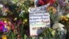 A prayer left among the flowers outside Emanuel AME Church, Charleston, South Carolina, June 21, 2015. (Jerome Socolovsky/VOA)