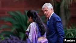 U.S. Secretary of Defense Chuck Hagel (R) arrives for a meeting with India's Foreign Minister Sushma Swaraj (not pictured) in New Delhi, August 8, 2014.