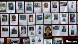 Photos of some of those killed are posted at a memorial in Kyiv's Independence Square on Feb. 25, 2014.