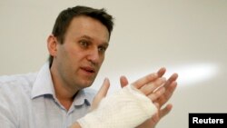 Russian opposition leader and anti-graft blogger Alexei Navalny speaks during an interview with Reuters at his office in Moscow, Apr. 15, 2013.