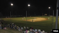 Fans gather to watch the Orleans Firebirds during the Cape Cod Baseball League's summer season. (VOA/D. Gruenbaum)