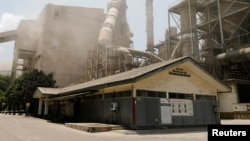 Fumes and dust are seen at Indonesian cement manufacturer PT Solusi Bangun Indonesia Tbk (SBI) in Bogor, West Java province, Indonesia, Sept. 21, 2021.