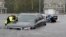 Members of the North Carolina Task Force urban search and rescue team check cars in a flooded neighborhood looking for residents who stayed behind as Florence continues to dump heavy rain in Fayetteville, N.C., Sunday, Sept. 16, 2018.