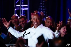 FILE - New York City Mayor-elect Eric Adams smiles at supporters, in New York, Nov. 2, 2021.