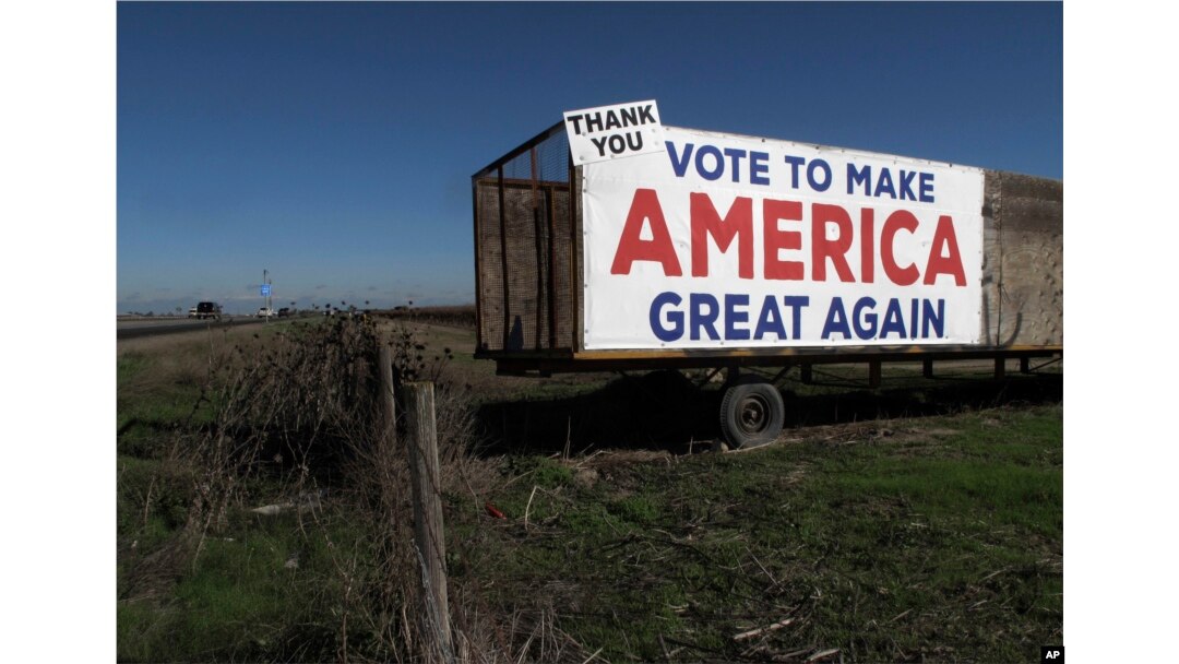 A Trump campaign sign is displayed near Los Banos, California, Dec. 16, 2016. A local farmer says Donald Trump's campaign vow to deport immigrants who are in the country illegally pushed him to buy more equipment, cutting the number of workers he’ll need.