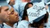 FILE - A graduate from Columbia University's School of Engineering sleeps during the university's commencement ceremony in New York, May 16, 2012.