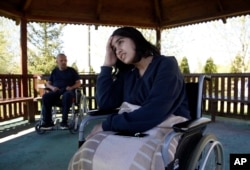 Fatima Bakhshi, a migrant from Afghanistan, uses a wheelchair in a small care home in the village of Doljevac, in southern Serbia, April 10, 2017.